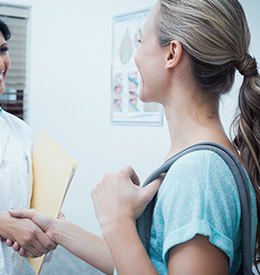 Two women shaking hands