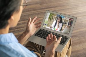 Patient attending teledentistry call with periodontist in Towson